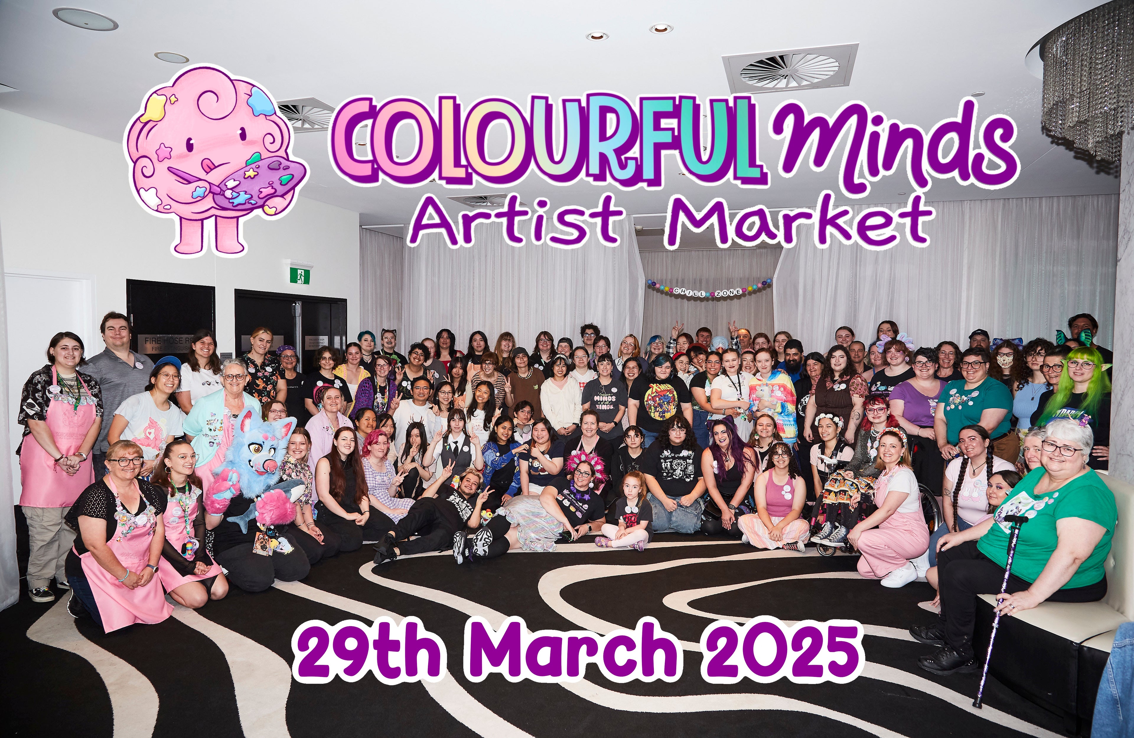 Group of people at an event titled 'Colourful Minds Artist Market' on 29th March 2025.